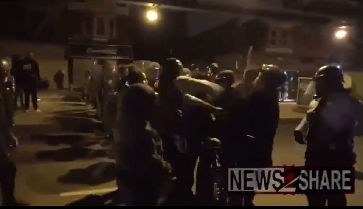 Rioter attacking police