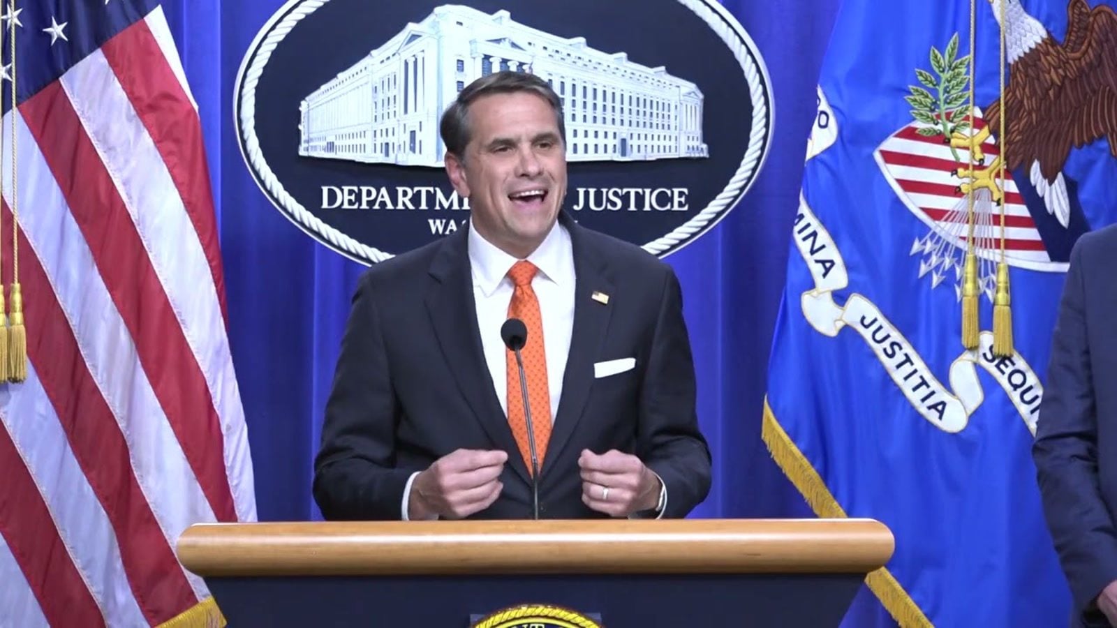 Deputy Attorney General Todd Blanche speaks at the Justice Department podium