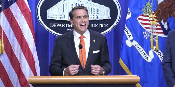 Deputy Attorney General Todd Blanche speaks at the Justice Department podium
