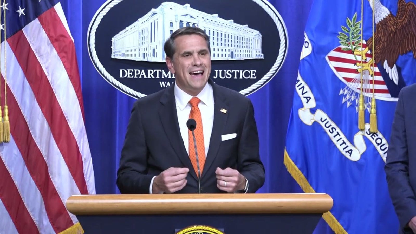 Deputy Attorney General Todd Blanche speaks at the Justice Department podium