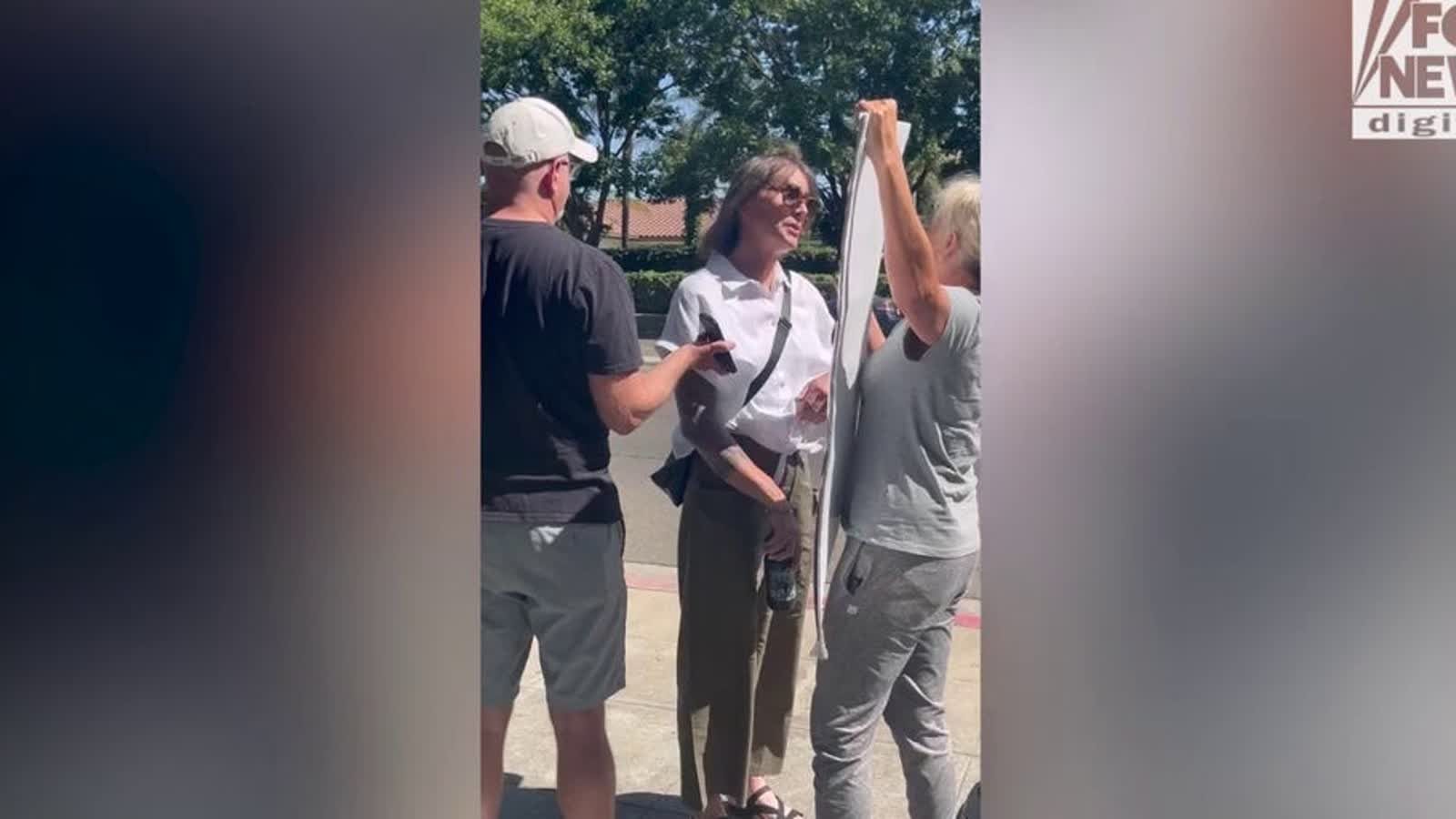 Activists confront each other outside a California state track meet involving trans athlete AB Hernandez