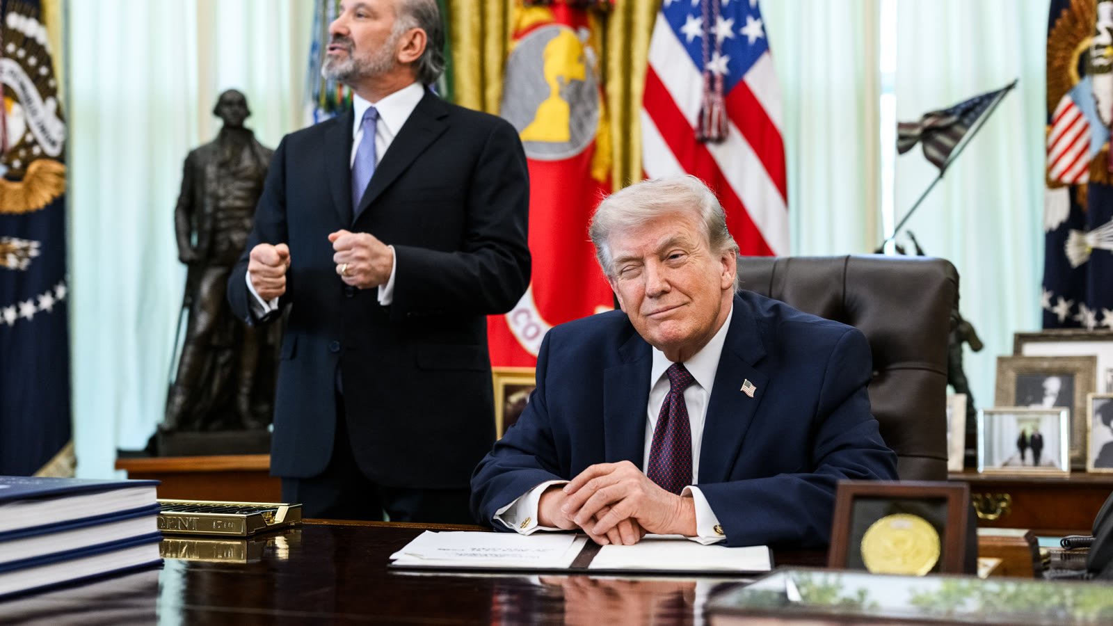 President Trump signs an executive order limiting mail-in voting in the Oval Office