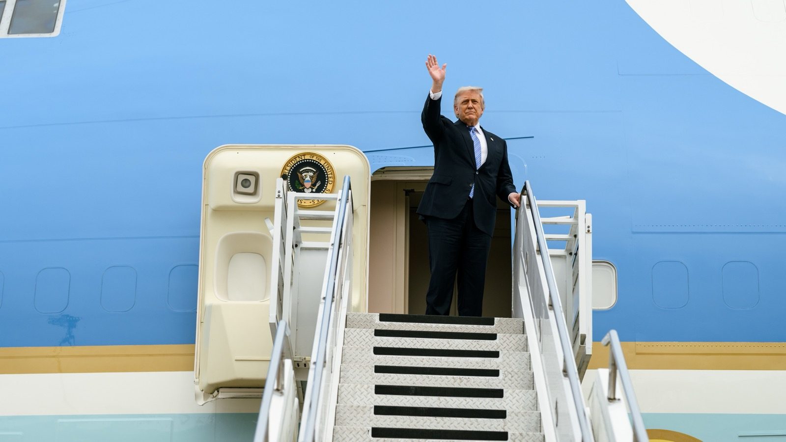 President Donald Trump boards Air Force One in China