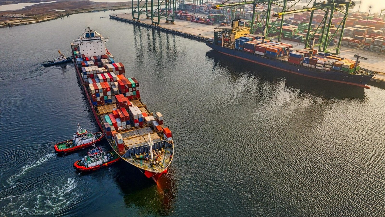 Container ships and cargo cranes at a port representing U.S. export activity