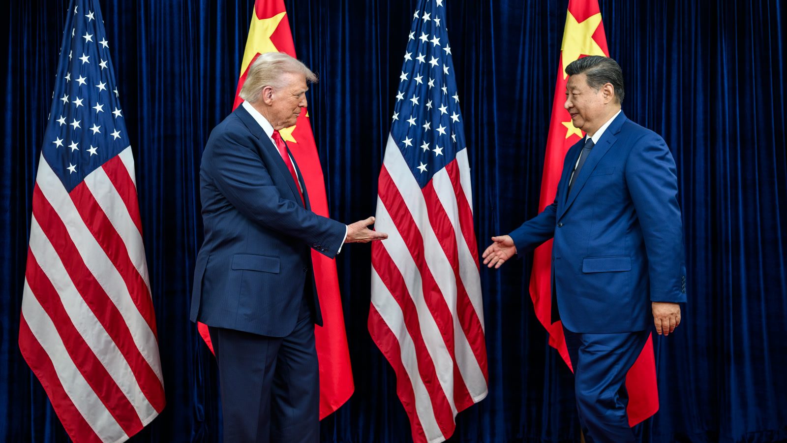 President Donald Trump greets Chinese President Xi Jinping before a bilateral meeting