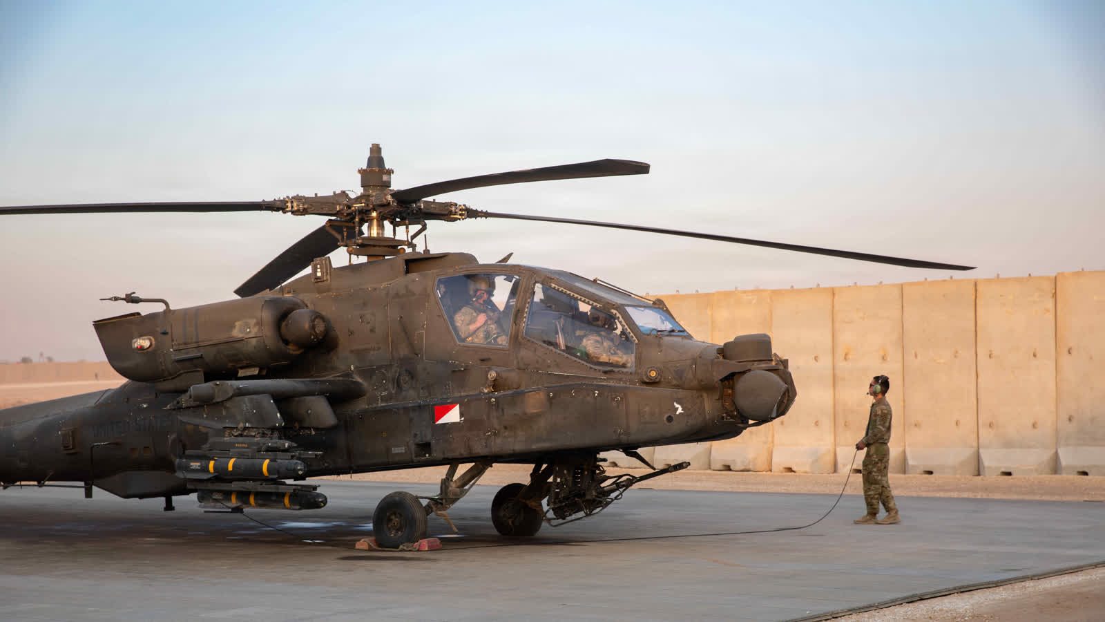 Official public domain rights-free U.S. Army photo of an AH-64 Apache helicopter in the CENTCOM area of responsibility
