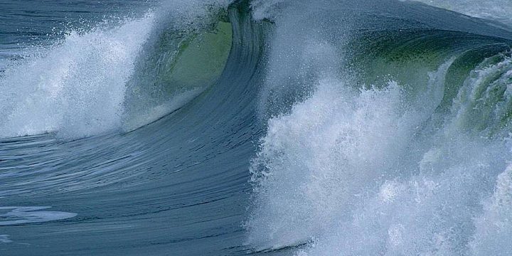 Large ocean waves breaking near shore