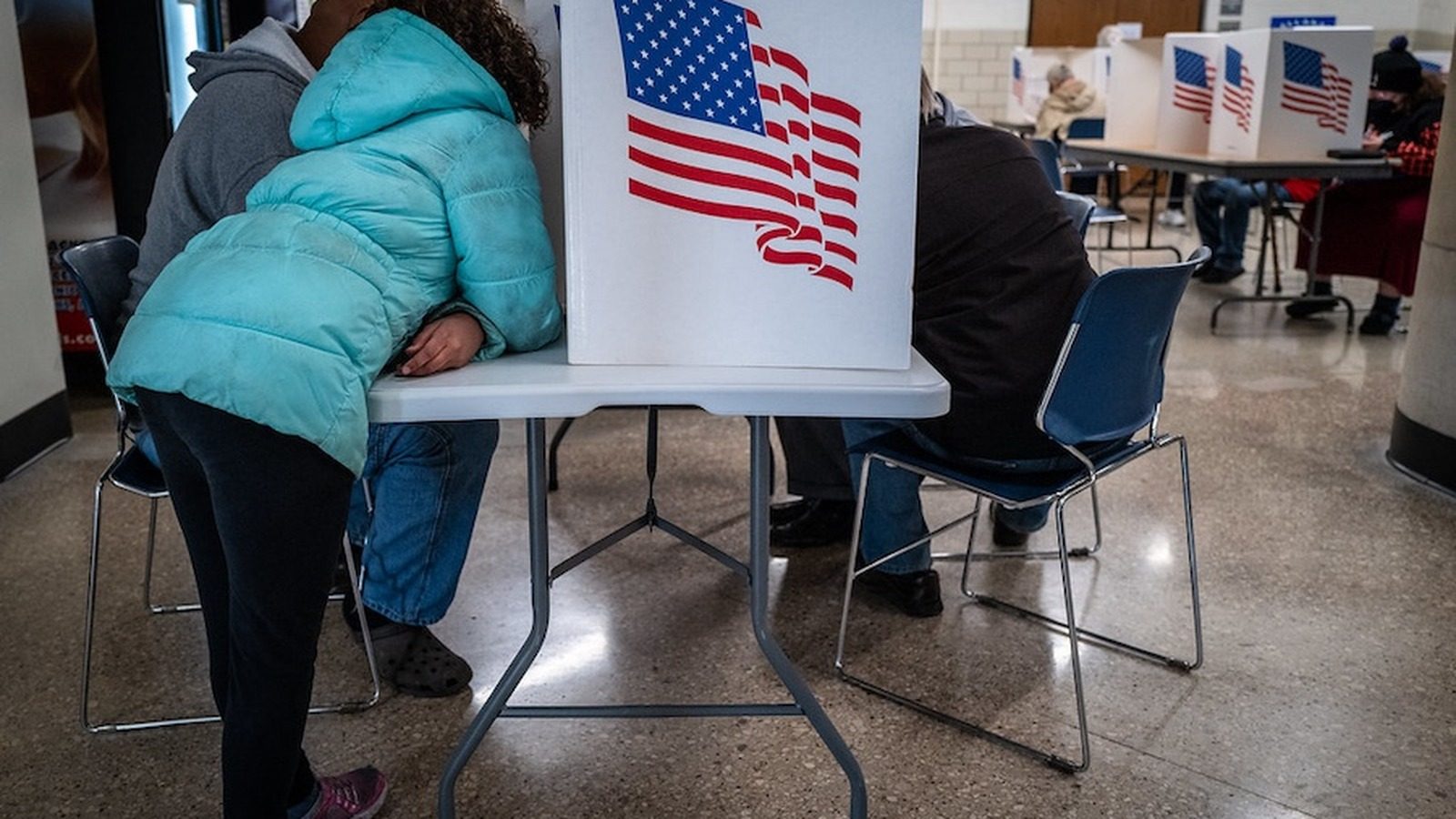 Voters cast ballots at an election voting center