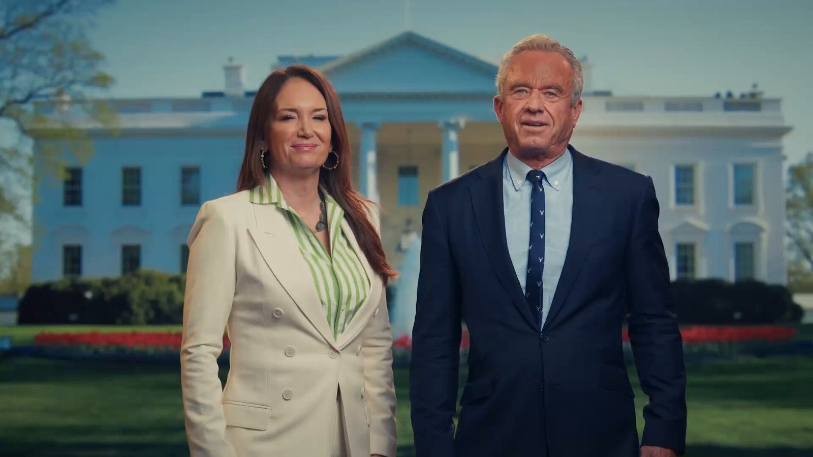 Official photo of Secretary Kennedy and Secretary Brooke Rollins discussing President Trump regenerative agriculture order