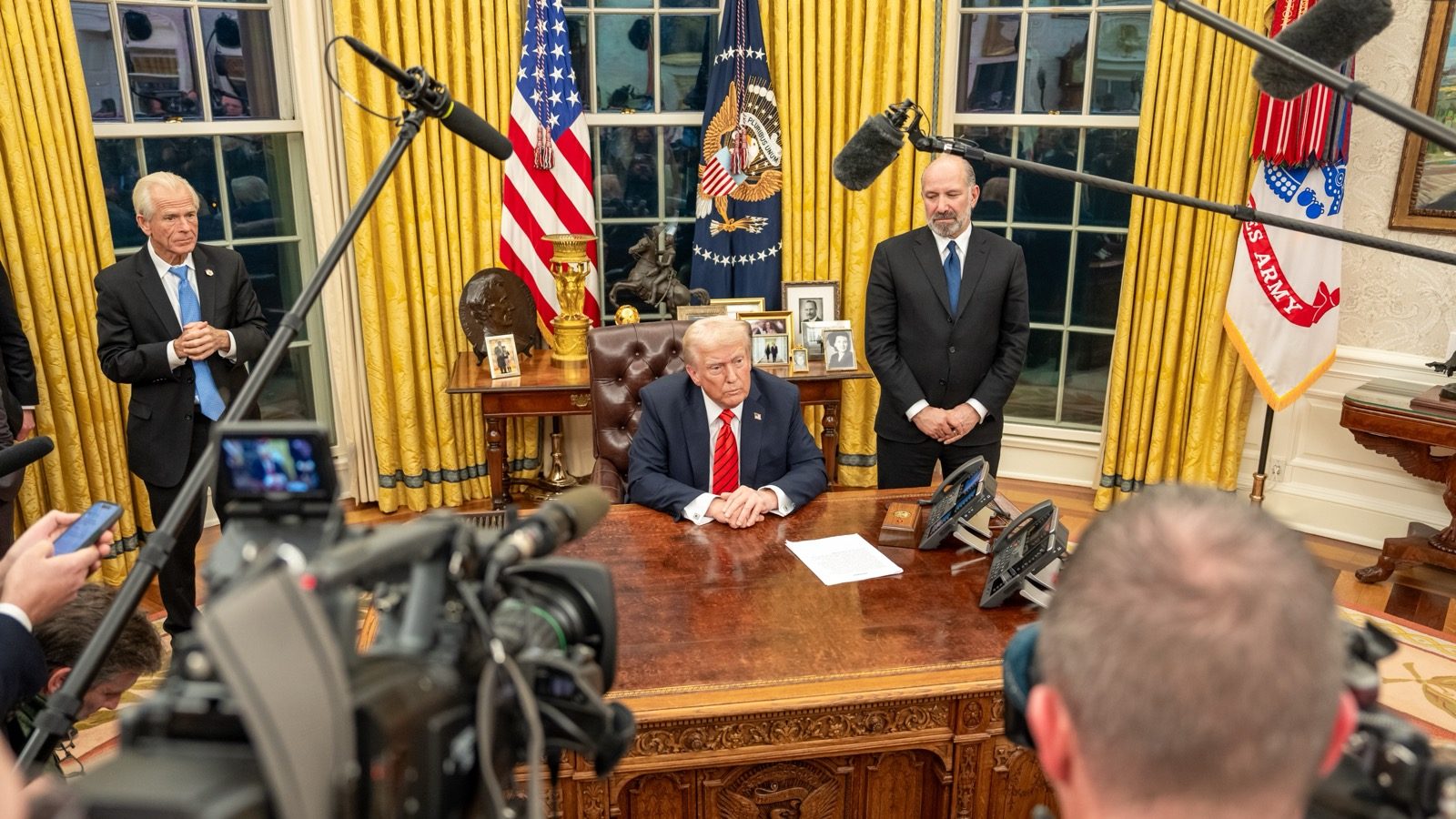 President Trump at the Resolute Desk during an executive order signing in the Oval Office