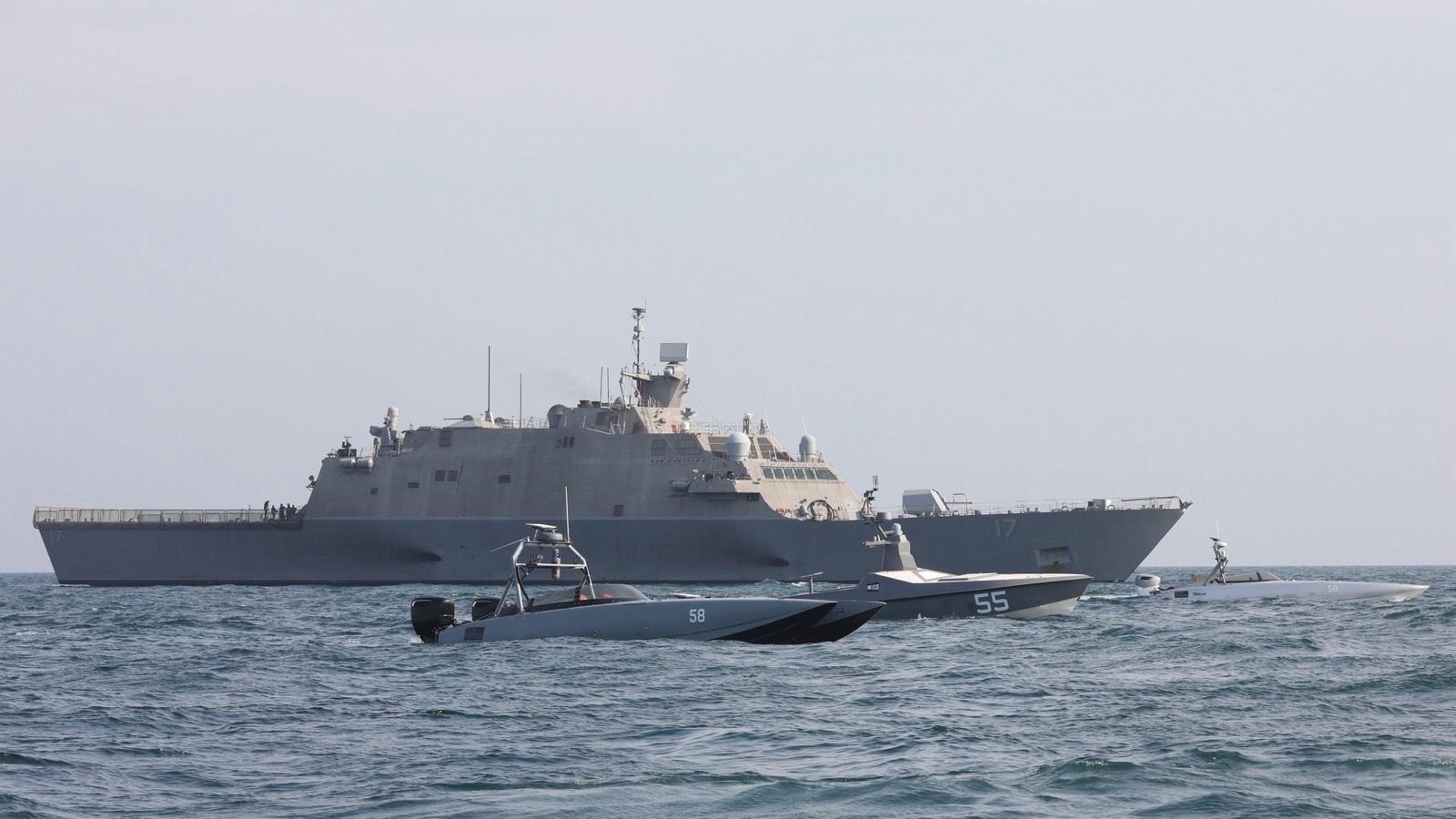 USS Indianapolis sails with Task Force 59 unmanned surface vessels in the Arabian Gulf