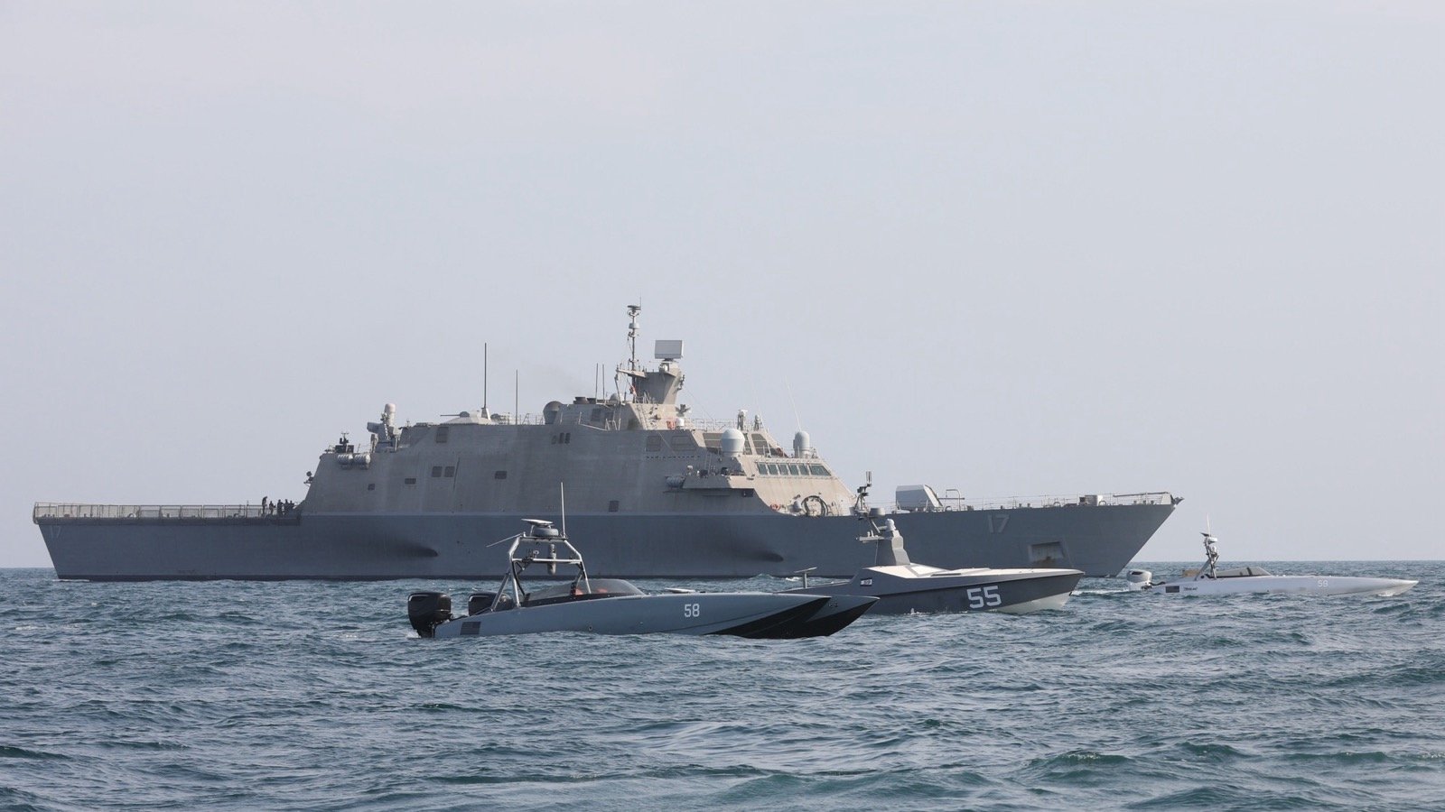 USS Indianapolis sails with Task Force 59 unmanned surface vessels in the Arabian Gulf