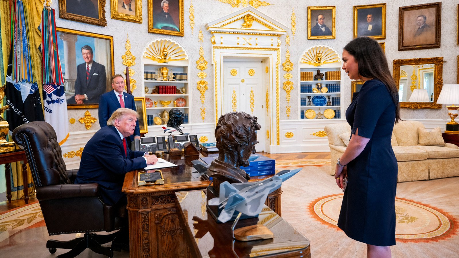 White House Deputy Press Secretary Abigail Jackson speaks with President Trump in the Oval Office
