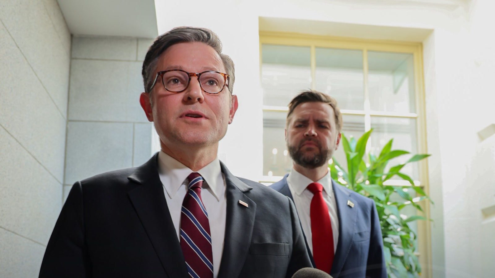 Speaker Mike Johnson speaks to reporters with Vice President JD Vance behind him during a Capitol Hill press availability