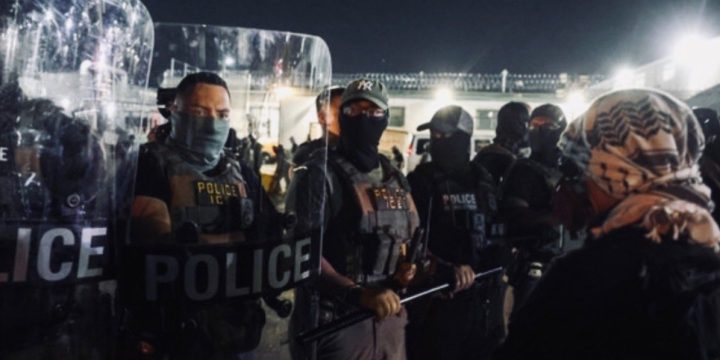 Official DHS photo shows federal immigration officers in protective equipment during an enforcement operation