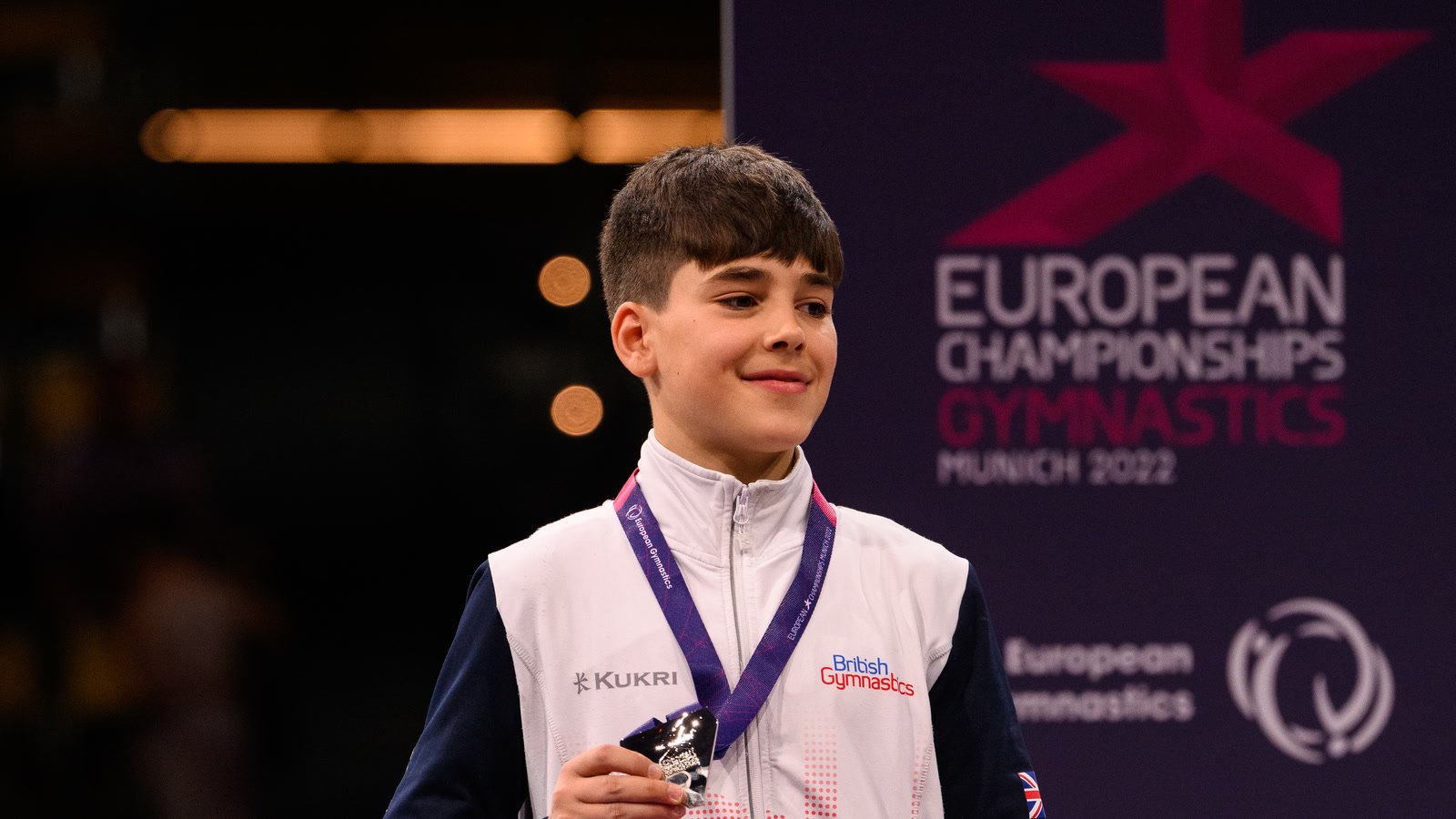 England gymnast Gabriel Langton wearing a medal at the European Gymnastics Championships
