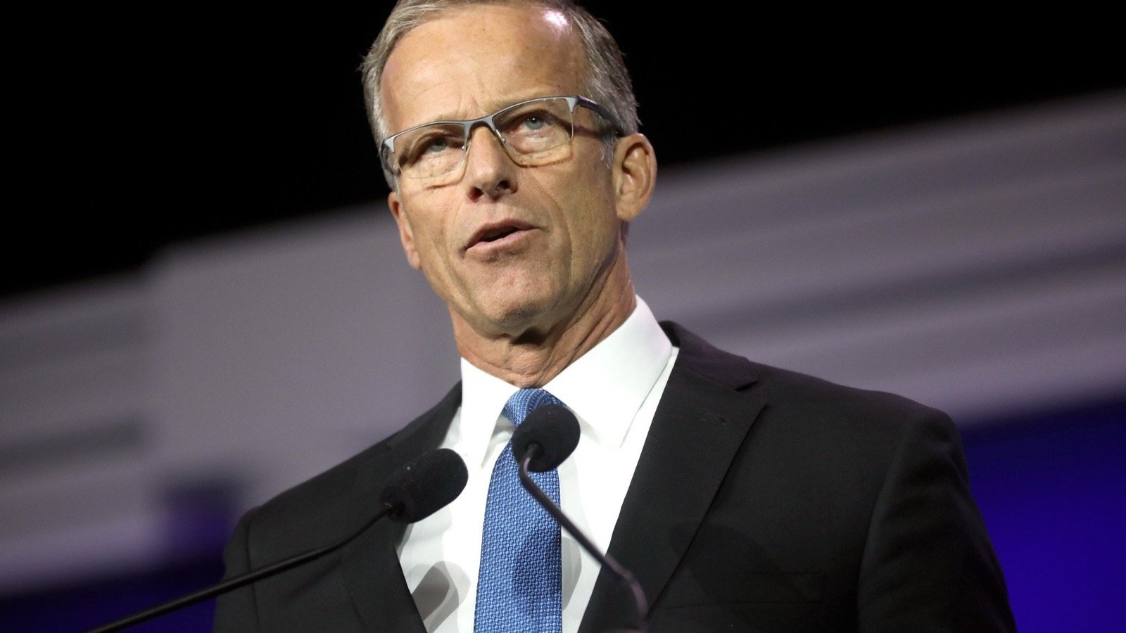 Senate Majority Leader John Thune speaks at a podium