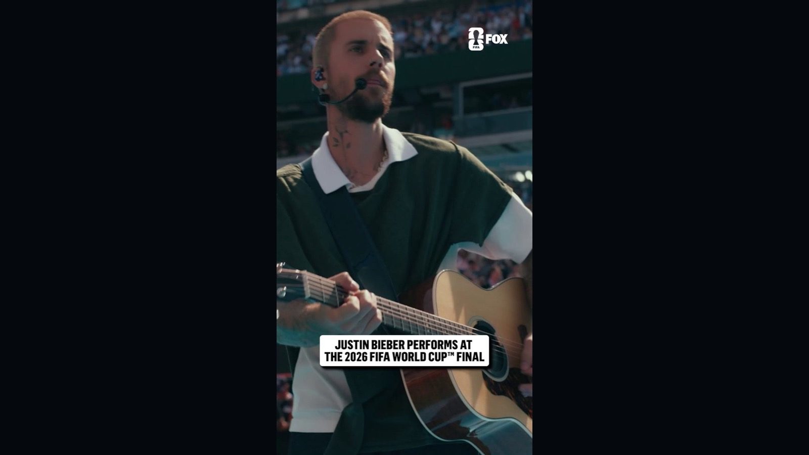 Justin Bieber playing an acoustic guitar during the 2026 FIFA World Cup final halftime show