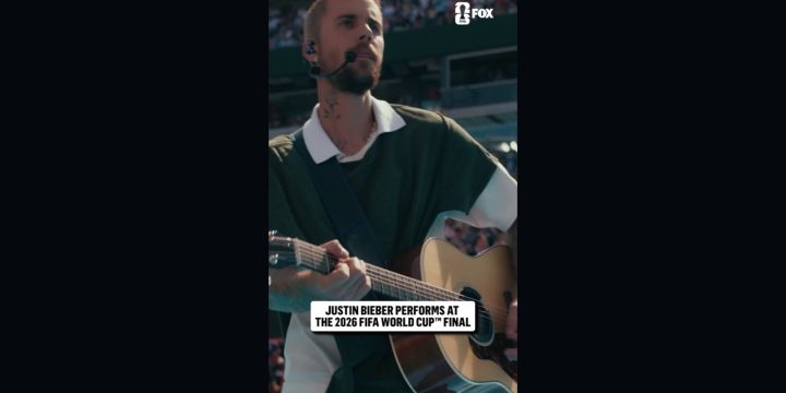 Justin Bieber playing an acoustic guitar during the 2026 FIFA World Cup final halftime show