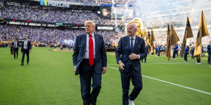 President Trump walking on the MetLife Stadium field with FIFA President Gianni Infantino during the 2025 FIFA Club World Cup final