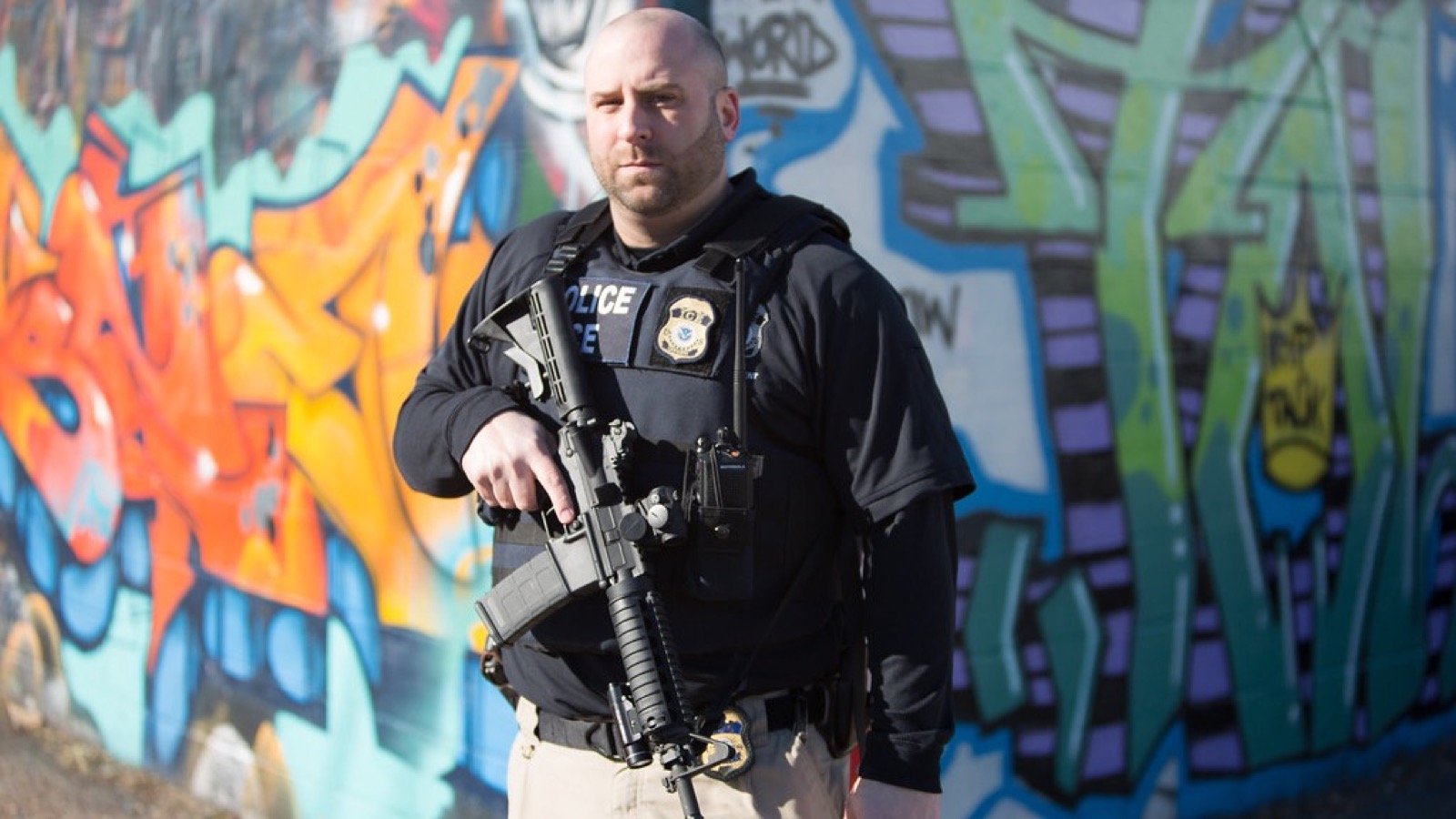 An ICE Enforcement and Removal Operations officer wearing tactical gear during an official operation