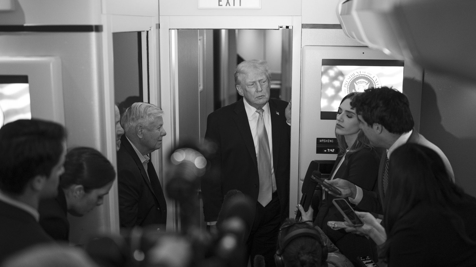 President Trump and Senator Lindsey Graham speak with reporters aboard Air Force One
