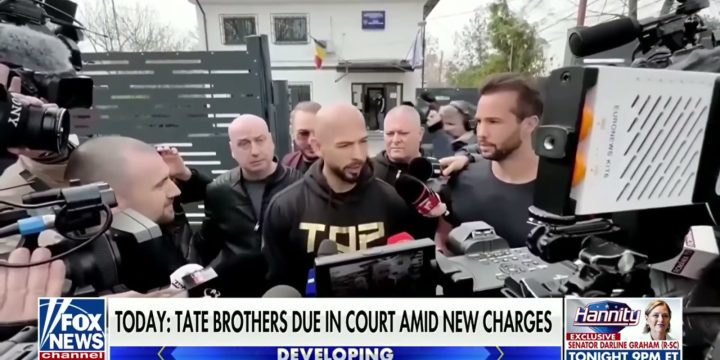 Andrew and Tristan Tate surrounded by members of the press