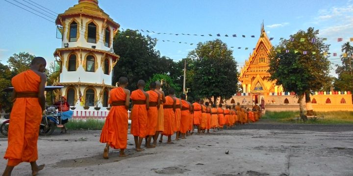 Thai Buddhist monks walking in a peace walk at a temple in northeastern Thailand