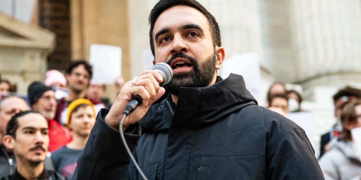 New York City Mayor Zohran Mamdani speaking into a microphone before a crowd