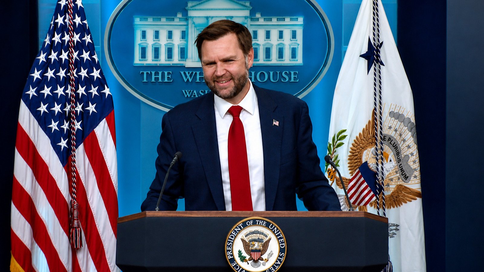 Vice President JD Vance smiling while briefing reporters at the White House