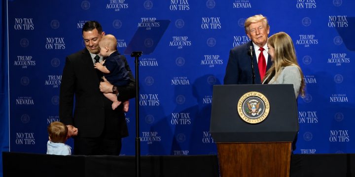 President Trump stands with a Las Vegas working family and their two young children during an economic event