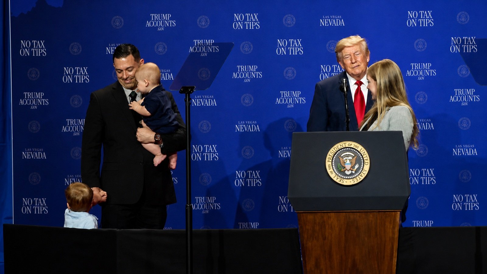 President Trump stands with a Las Vegas working family and their two young children during an economic event