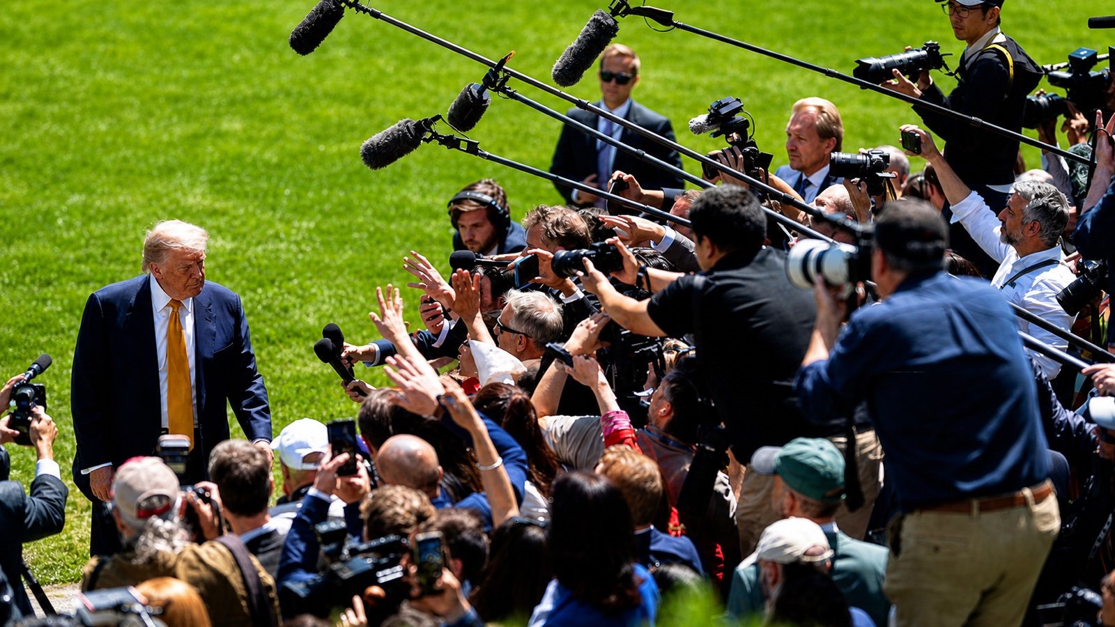 President Trump speaks with reporters on the White House South Lawn
