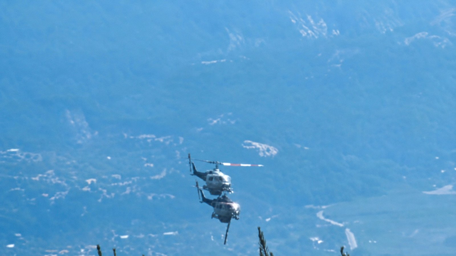 Two firefighting helicopters moments before colliding during wildfire operations near Psatha, Greece