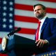 Vice President JD Vance at a podium with an American flag behind him
