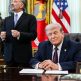 President Trump signs an executive order limiting mail-in voting in the Oval Office