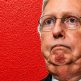 Mitch McConnell pictured with emergency medical imagery in a textured hospital report graphic