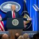 President Trump speaking from a podium at the Justice Department