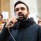 New York City Mayor Zohran Mamdani speaking into a microphone before a crowd